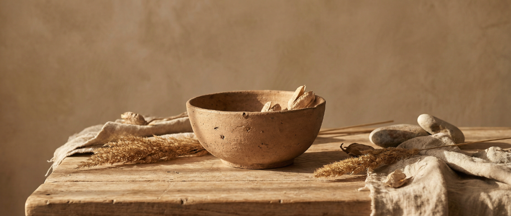 Earthen bowl on a rustic wooden table